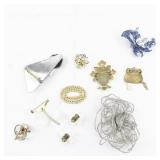 Group of 11 Base Metal Brooches.