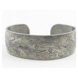 Floral Silver Tone Base Metal Bangle Bracelet.