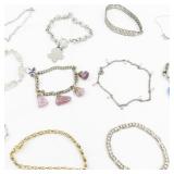 Set of twelve  Gold Tone Base Metal Bracelets.