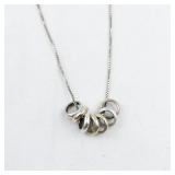 Seven Ring Tri-Tone Sterling Silver Pendant Necklace .