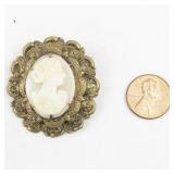 Vintage Carved White Cameo Gold Tone Base Metal Brooch .