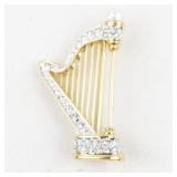 Rhinestone Accented Harp Gold Tone Base Metal Brooch .