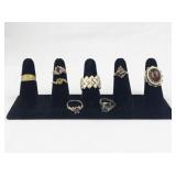 Set of Eight Gold Tone Base Metal Rings . Size 7.75-8.5.