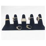 Set of Eight Gold Tone Base Metal Rings . Size 7.75-8.5.