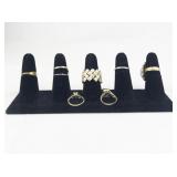 Set of Eight Gold Tone Base Metal Rings . Size 7.75-8.5.