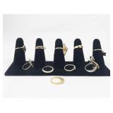 Set of ten  Gold Tone Base Metal Rings . Size 6.75-7.25.