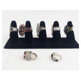 Set of seven  Silver Tone Base Metal Rings. Size 8--9.
