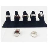 Set of seven  Silver Tone Base Metal Rings. Size 8--9.