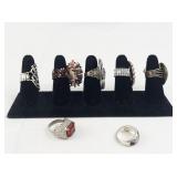 Set of seven  Silver Tone Base Metal Rings. Size 8--9.