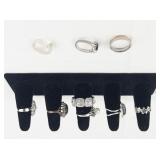 Set of eight  Silver Tone Base Metal Rings . Size 8.75-9.75.