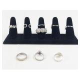 Set of eight  Silver Tone Base Metal Rings . Size 8.75-9.75.