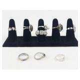 Set of eight  Silver Tone Base Metal Rings . Size 8.75-9.75.