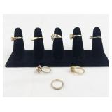 Set of eight  Gold Tone Base Metal Rings . Size 6-6.75.