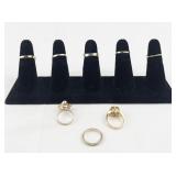 Set of eight  Gold Tone Base Metal Rings . Size 6-6.75.