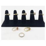 Set of eight  Gold Tone Base Metal Rings . Size 6-6.75.