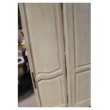 Elegant Vintage Armoire with Intricate Carved Detailing