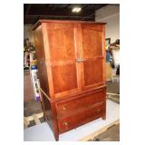 Sturdy Wooden Armoire with Shelves and Drawers