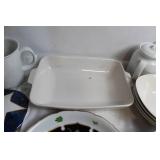 Mixed Set of Porcelain Kitchenware including Plates, Bowls, and Mugs