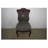 Needlepoint chair with front roller...
