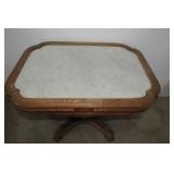 Wood table  heavily carved with mar...