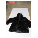 Brown fur coat and black one is fur...