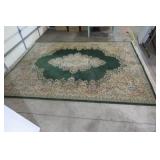 Large area rug, done in greens and ...