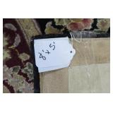 Area rug with cranberry and blacks,...