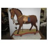 Burlap horse on wood base with whee...