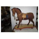 Burlap horse on wood base with whee...