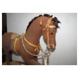 Burlap horse on wood base with whee...