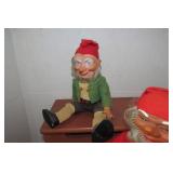 Gnome and elf sitting on steps, one...