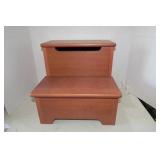 Gnome and elf sitting on steps, one...