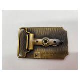 Collection of 2 Vintage Zippo Lighters and Ambassador Hot Dog Belt Buckle