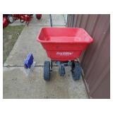 Small poly broadcast spreader. As shown.