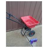 Small poly broadcast spreader. As shown.