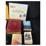 Collection of Books, Page Protectors, and Sleeves