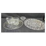 Set of Glass Dinnerware Pieces Including Plates and Mugs