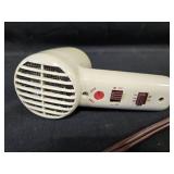 Collection of Vintage Hair Styling Tools including Hair Dryer and Curling Irons