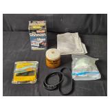 Assorted Household and Automotive Items Including Battery Charger and Vacuum Belts