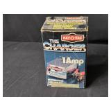 Assorted Household and Automotive Items Including Battery Charger and Vacuum Belts