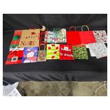 Assorted Christmas Gift Bags, Tags, and Decorative Items