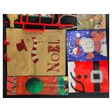 Assorted Christmas Gift Bags, Tags, and Decorative Items