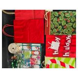 Assorted Christmas Gift Bags, Tags, and Decorative Items