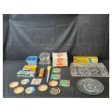 Assorted Household Items Including Glass Platters, Coasters, and Storage