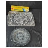 Assorted Household Items Including Glass Platters, Coasters, and Storage