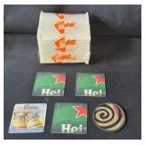 Assorted Household Items Including Glass Platters, Coasters, and Storage