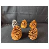 Assorted Holiday Decorations Including Pinecones and LED Lights