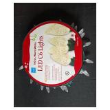 Assorted Holiday Decorations Including Pinecones and LED Lights