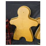 Holiday Decor Collection: Stuffed Bunny, Gingerbread Pans, Red Gift Box Wire Frame, and Poinsettia Arrangement