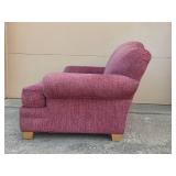 Cozy Plum-Colored Armchair with Decorative Pillow